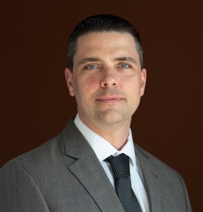 headshot of adam eckhart